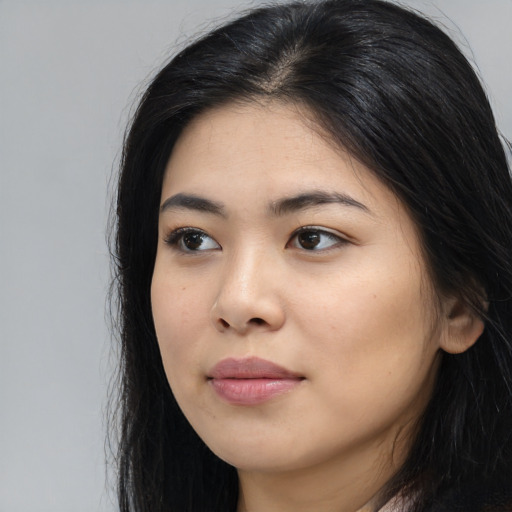 Neutral asian young-adult female with long  black hair and brown eyes