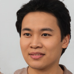 Joyful asian young-adult male with short  black hair and brown eyes