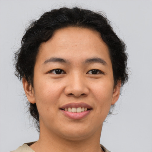 Joyful asian young-adult female with short  brown hair and brown eyes