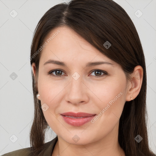 Joyful white young-adult female with long  brown hair and brown eyes