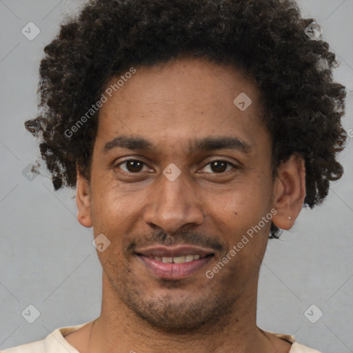 Joyful latino adult male with short  brown hair and brown eyes