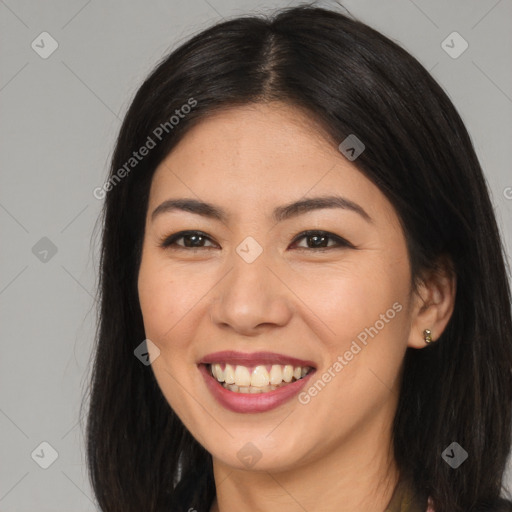 Joyful asian young-adult female with long  brown hair and brown eyes