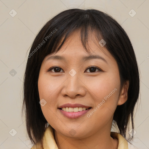 Joyful asian young-adult female with medium  brown hair and brown eyes