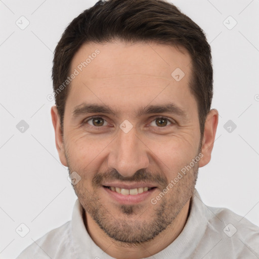 Joyful white adult male with short  brown hair and brown eyes