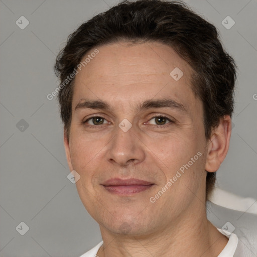 Joyful white adult male with short  brown hair and brown eyes