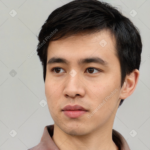 Neutral white young-adult male with short  black hair and brown eyes