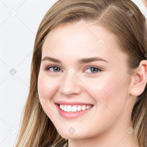 Joyful white young-adult female with long  brown hair and blue eyes