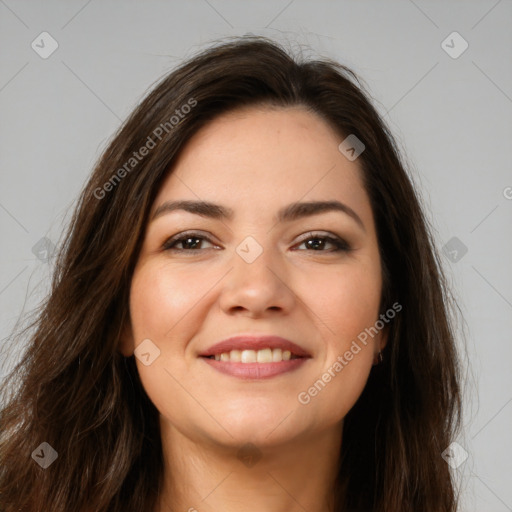 Joyful white young-adult female with long  brown hair and brown eyes