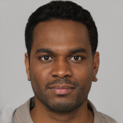 Neutral black young-adult male with short  black hair and brown eyes