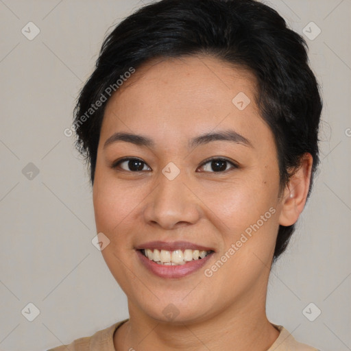 Joyful asian young-adult female with short  brown hair and brown eyes