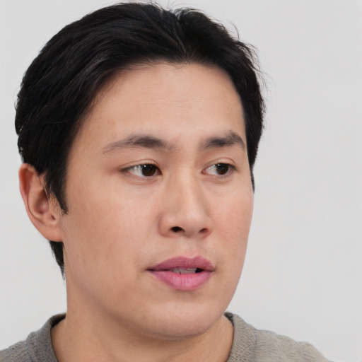 Neutral asian young-adult male with short  brown hair and brown eyes