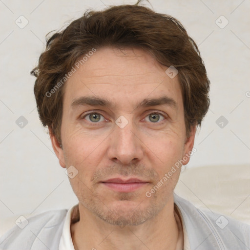 Joyful white adult male with short  brown hair and grey eyes