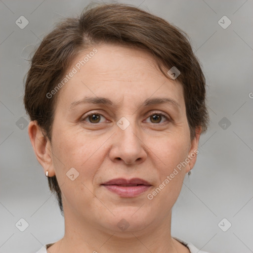 Joyful white adult female with short  brown hair and grey eyes