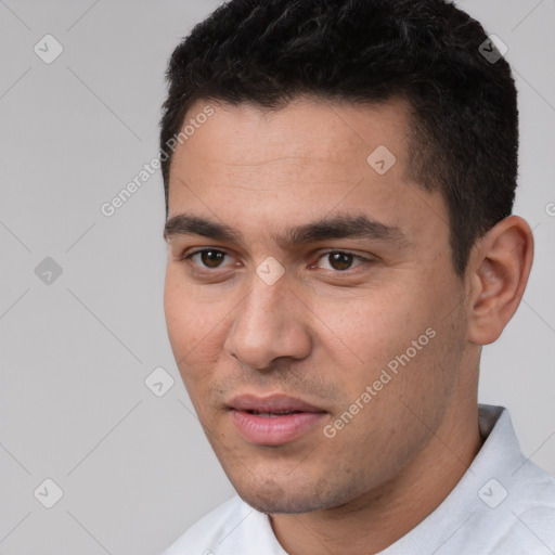 Joyful white young-adult male with short  black hair and brown eyes