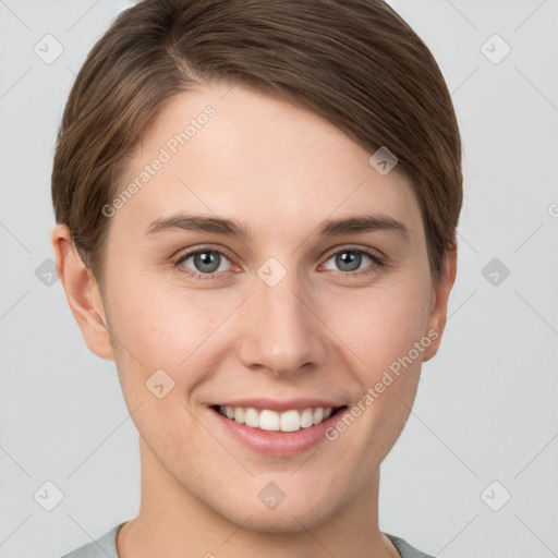 Joyful white young-adult female with short  brown hair and grey eyes