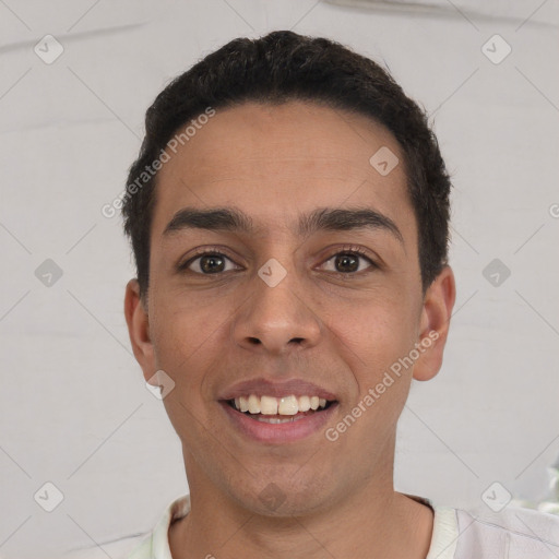 Joyful white young-adult male with short  black hair and brown eyes