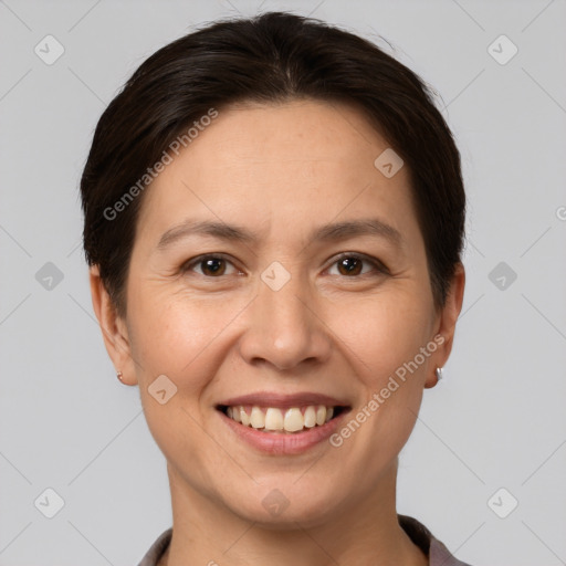 Joyful white young-adult female with short  brown hair and brown eyes