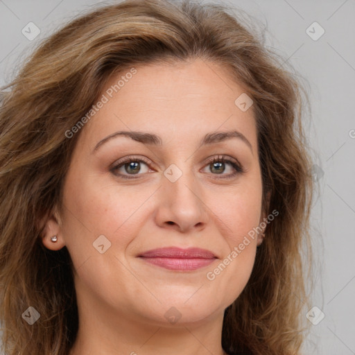 Joyful white adult female with long  brown hair and brown eyes