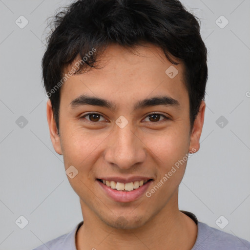 Joyful asian young-adult male with short  brown hair and brown eyes