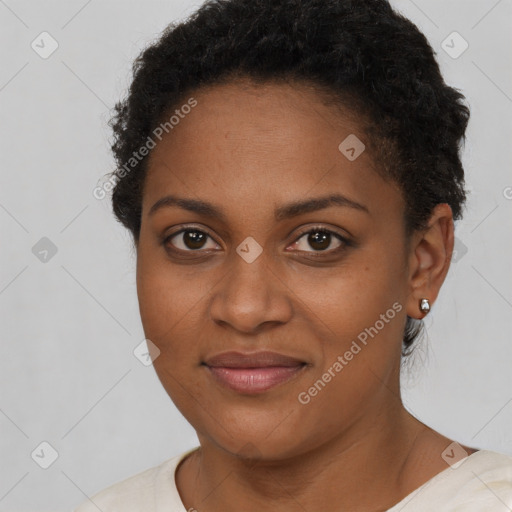 Joyful black young-adult female with short  brown hair and brown eyes