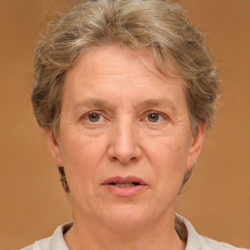 Joyful white middle-aged female with short  brown hair and brown eyes