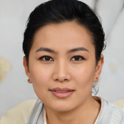 Joyful asian young-adult female with short  black hair and brown eyes