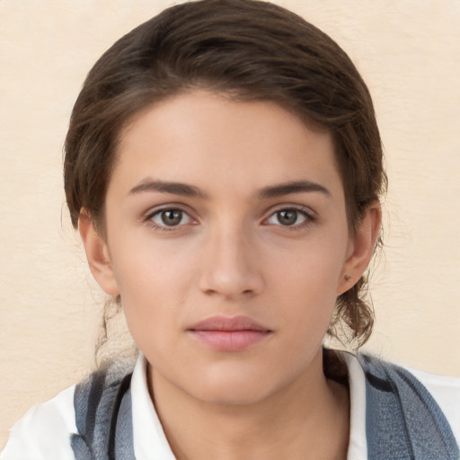 Neutral white young-adult female with short  brown hair and brown eyes