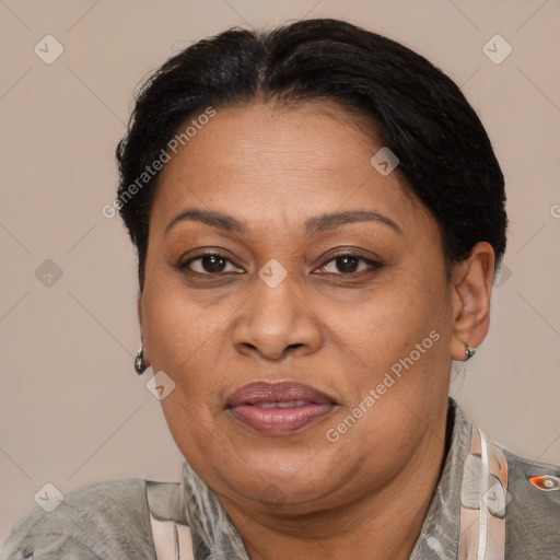 Joyful latino adult female with short  brown hair and brown eyes