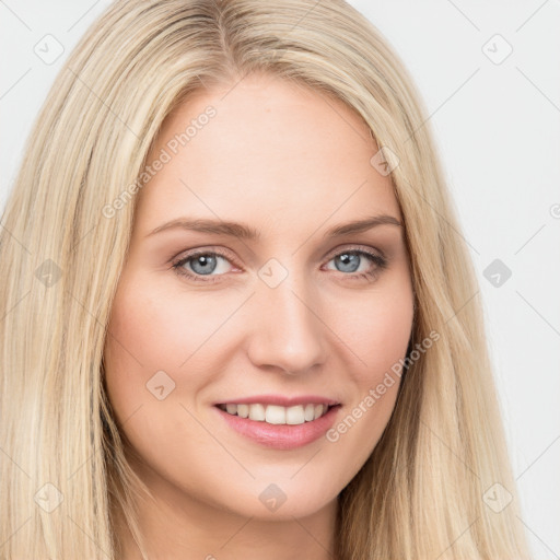 Joyful white young-adult female with long  brown hair and blue eyes