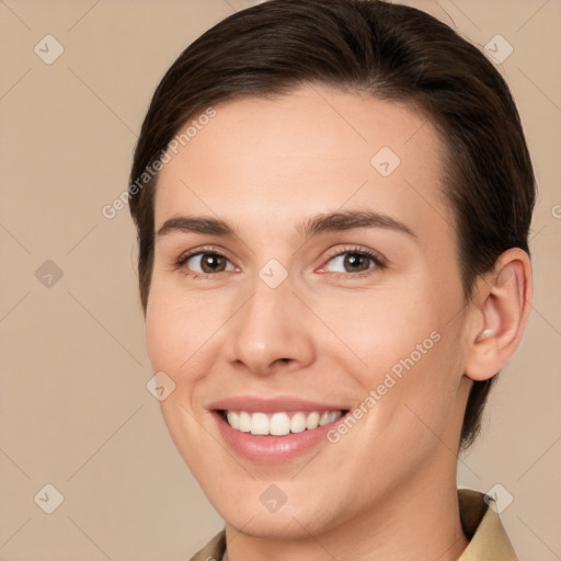 Joyful white young-adult female with medium  brown hair and brown eyes