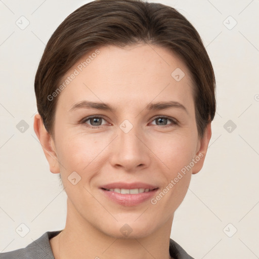 Joyful white young-adult female with short  brown hair and grey eyes