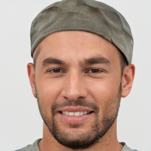 Joyful white young-adult male with short  black hair and brown eyes