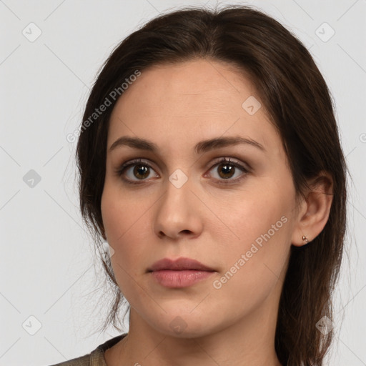 Neutral white young-adult female with long  brown hair and brown eyes