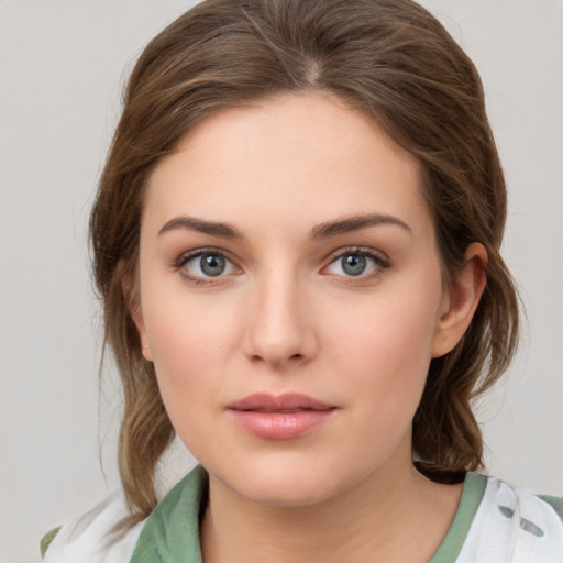 Neutral white young-adult female with medium  brown hair and green eyes