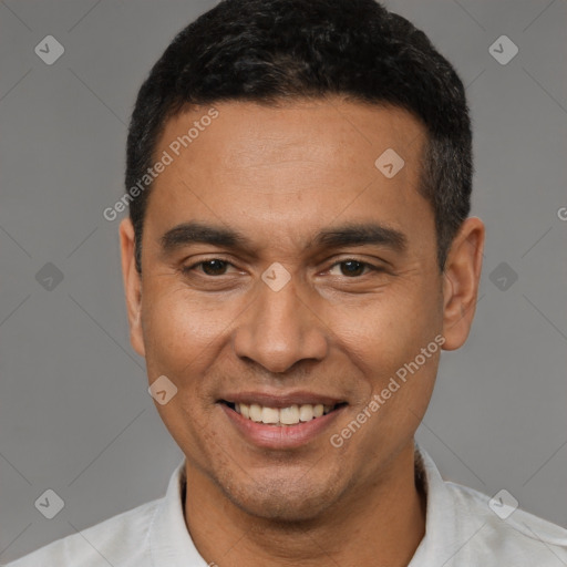 Joyful latino young-adult male with short  black hair and brown eyes