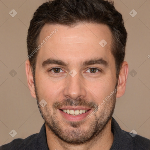 Joyful white adult male with short  brown hair and brown eyes