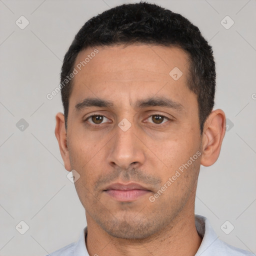Neutral white young-adult male with short  black hair and brown eyes