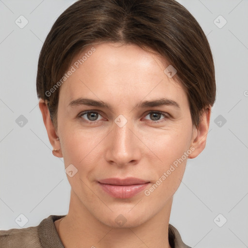 Joyful white young-adult female with short  brown hair and grey eyes