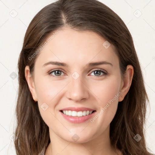 Joyful white young-adult female with long  brown hair and grey eyes