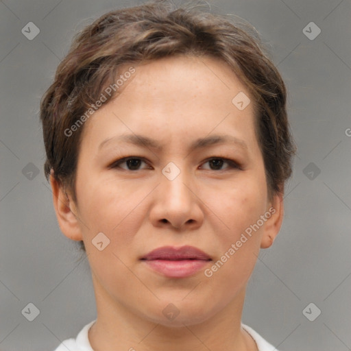 Joyful asian young-adult female with short  brown hair and brown eyes