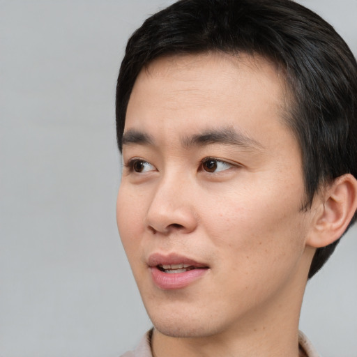 Neutral asian young-adult male with short  black hair and brown eyes