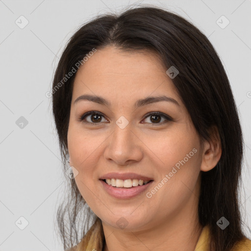 Joyful latino young-adult female with long  brown hair and brown eyes