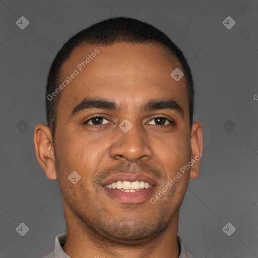 Joyful black young-adult male with short  brown hair and brown eyes