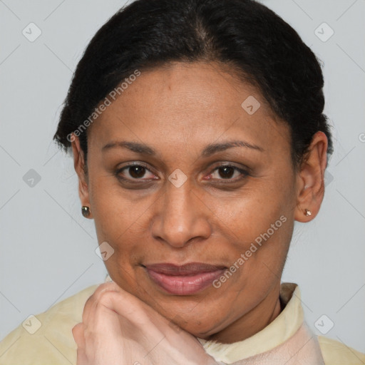 Joyful latino adult female with short  brown hair and brown eyes