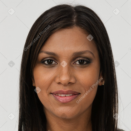 Joyful black young-adult female with long  brown hair and brown eyes