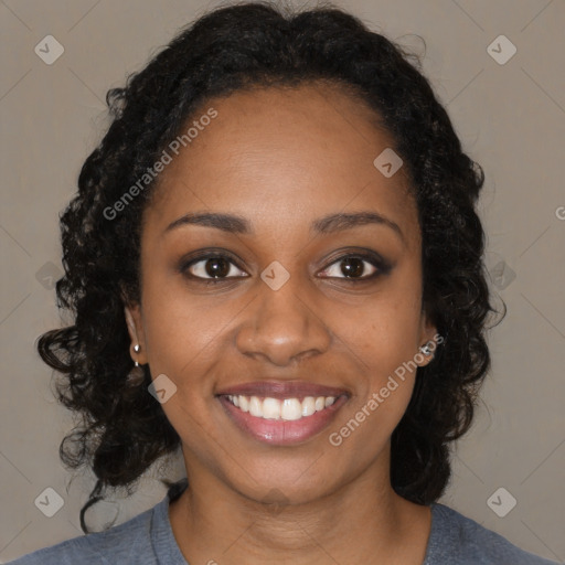 Joyful black young-adult female with medium  black hair and brown eyes