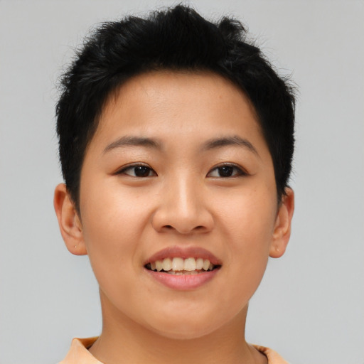 Joyful asian young-adult female with short  brown hair and brown eyes