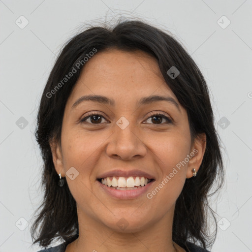 Joyful latino young-adult female with medium  brown hair and brown eyes