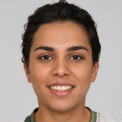 Joyful white young-adult female with short  black hair and brown eyes