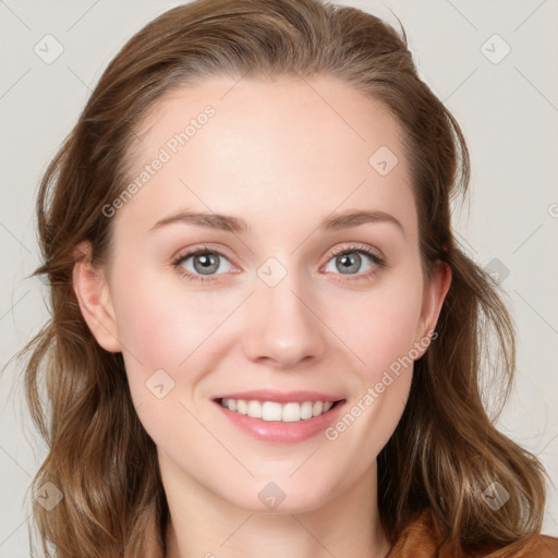 Joyful white young-adult female with long  brown hair and blue eyes